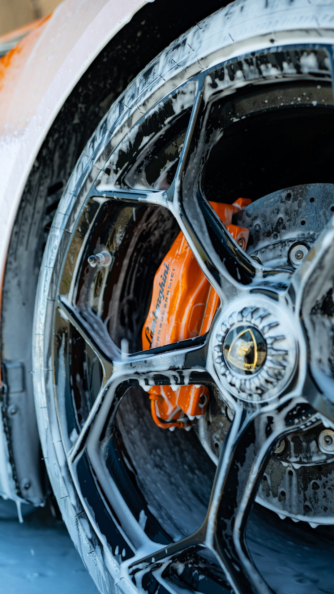 Detailed wheel and brake caliper on an exotic vehicle