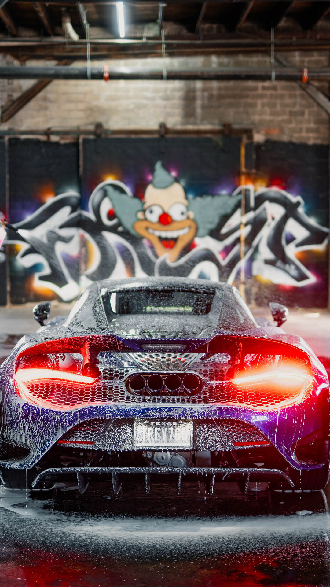 Exotic car against a graffiti wall