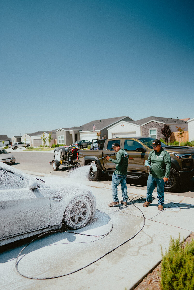 Crew washing a vehicle