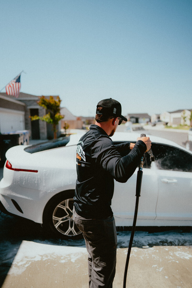 Washing a white sedan